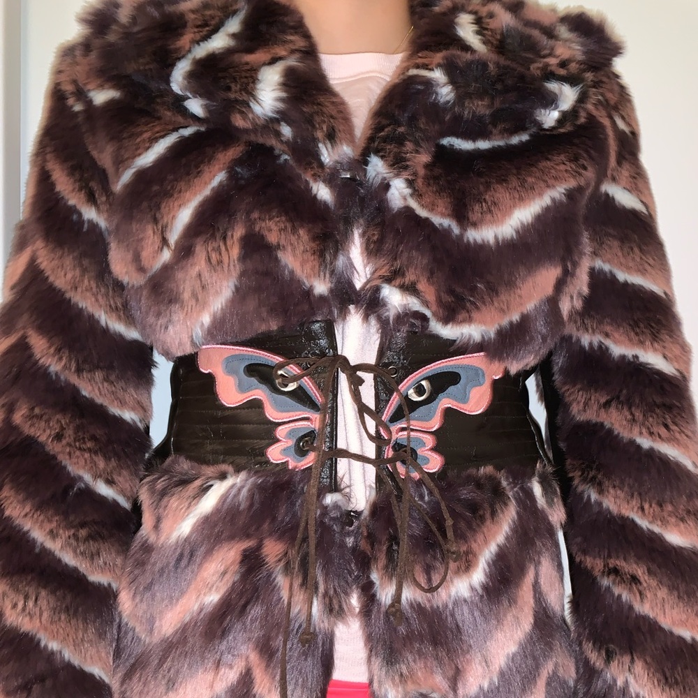 Jenifer Lopez faux fur coat with butterfly detail on the front tie